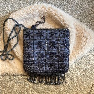 Black Quilted Crossbody Bag with Fringe Detail